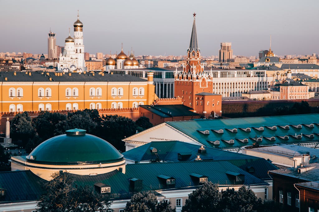 Stunning view of the Moscow Kremlin's iconic architecture at sunrise, showcasing its vibrant colors.